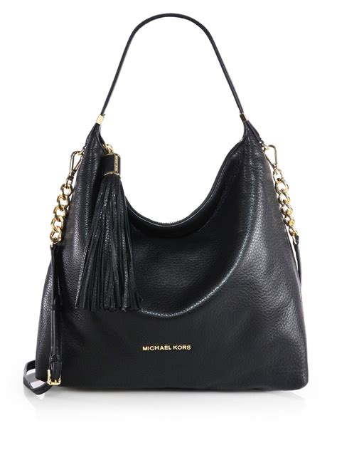 black michael kors purse|michael kors black shoulder handbags.